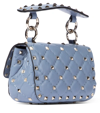 Shop Valentino Rockstud Spike Micro Leather Crossbody Bag In Blue
