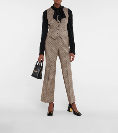 Shop Gucci G Jacquard High-rise Flared Wool Pants In Brown