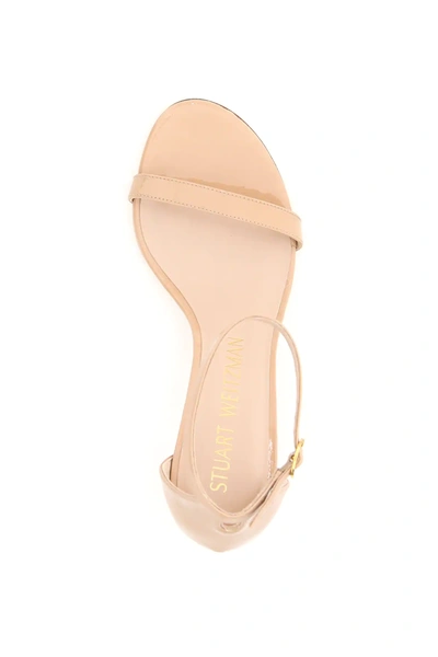Shop Stuart Weitzman Nunakedstraight Patent Leather Sandals In Pink,beige