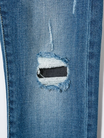 Shop Levi's Distressed Skinny Jeans In Blue