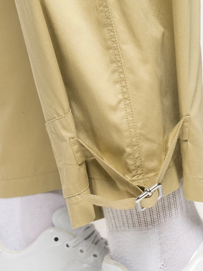 Shop Jw Anderson Belted Tapered Trousers In Neutrals