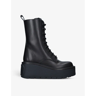 Shop Valentino Logo-embossed Leather Combat Boots In Black