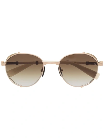 Shop Balmain Eyewear X Akoni Round Gradient Lens Sunglasses In Gold