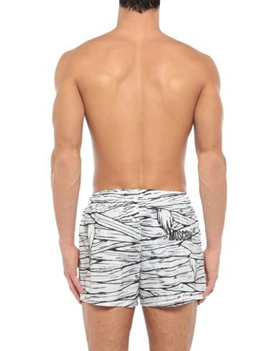 Shop Moschino Swim Trunks In White