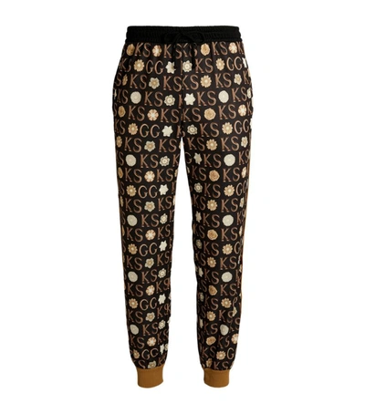 Shop Gucci + Ken Scott Monogram Print Track Pants