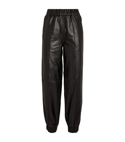 Shop Ganni Cuffed Leather Trousers