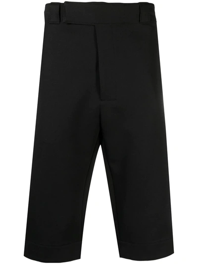 Shop Prada Logo Patch Cropped Trousers In Schwarz