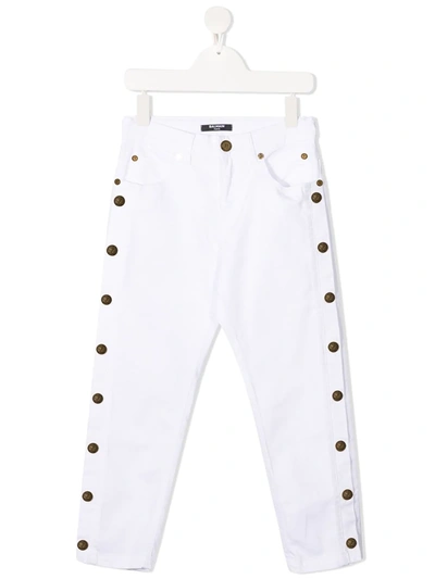 Shop Balmain Button-embellished Skinny Jeans In White