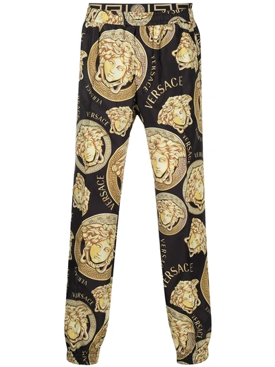 Shop Versace Graphic-print Track Pants In Black