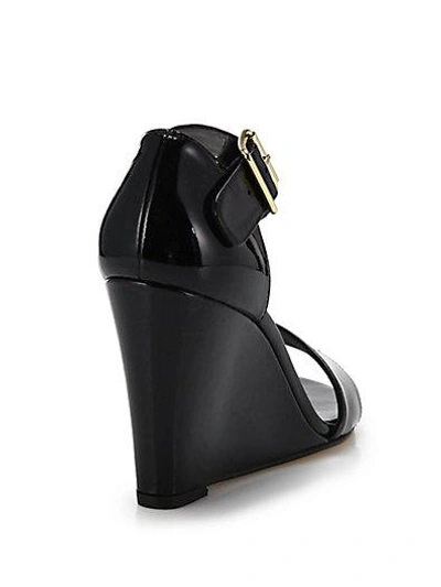 Shop Stuart Weitzman Patent Leather Wedge Sandals In Black