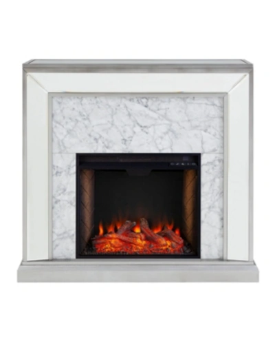 Shop Southern Enterprises Audrey Faux Stone Mirrored Alexa-enabled Electric Fireplace In Silver