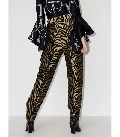 Shop Khaite Magdeline Zebra-print Trousers In Black/gold