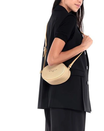 Shop Gaelle Paris Handbags In Gold