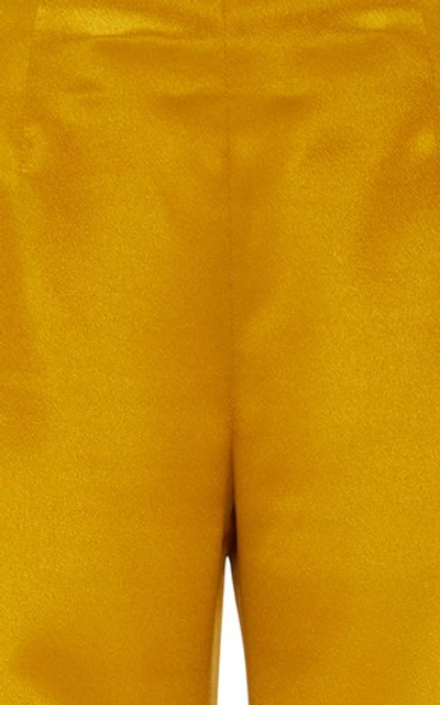 Shop Galvan Satin Flared Pants In Yellow