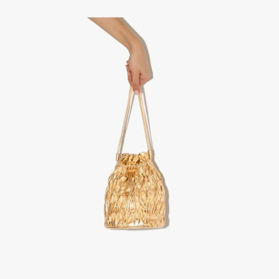 Shop Ganni Gold Ruched Leather Bucket Bag