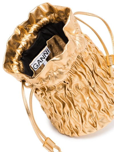 Shop Ganni Metallic Ruched Mini Bag In Gold