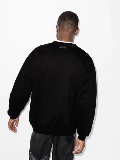 Shop Vetements Logo Print Sweatshirt In Black