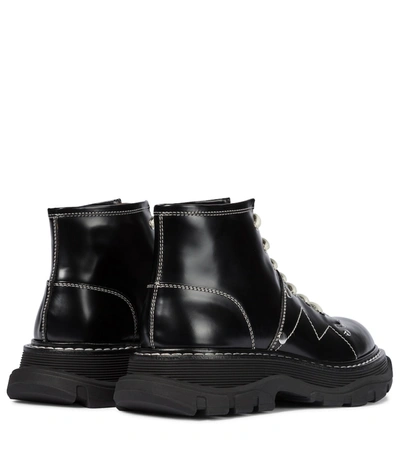 Shop Alexander Mcqueen Tread Leather Ankle Boots In Black