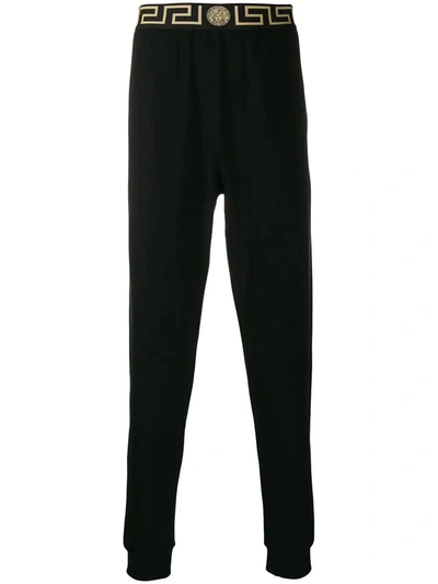 Shop Versace Greca Border Gym Trousers In Black