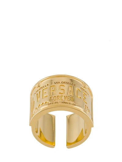 Shop Versace Engraved Logo Ring In Gold