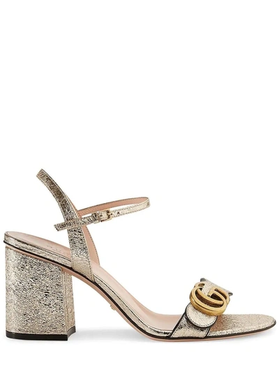 Shop Gucci Metallic Laminate Leather Mid-heel  Sandal In Gold