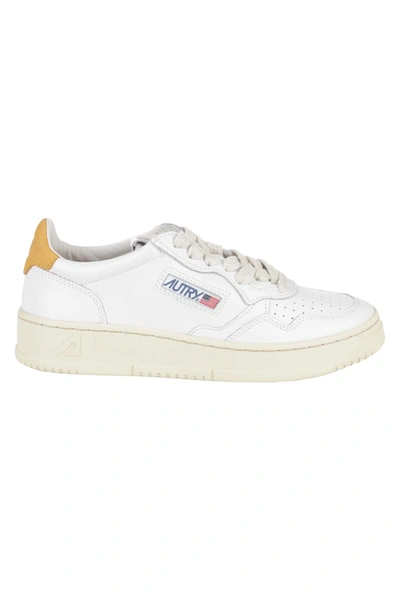 Shop Autry Sneakers In Whtgld Bianco Oro