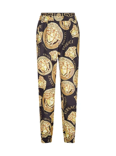 Shop Versace Logo And Medusa Print Track Pants In Nero Oro