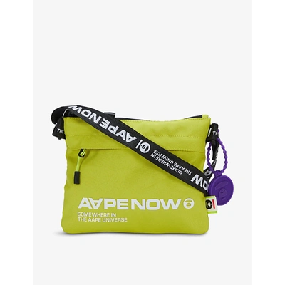 Shop Aape Logo-print Woven Cross-body Bag In Green