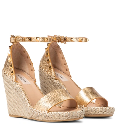 Shop Valentino Rockstud Leather Wedge Espadrilles In Gold