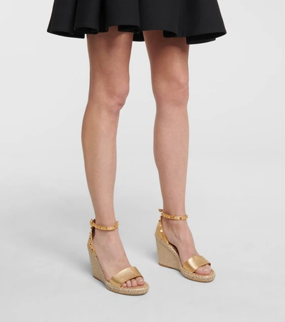 Shop Valentino Rockstud Leather Wedge Espadrilles In Gold