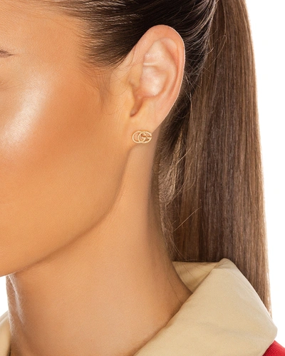 Shop Gucci Running G Stud Earrings In 18kt Yellow Gold