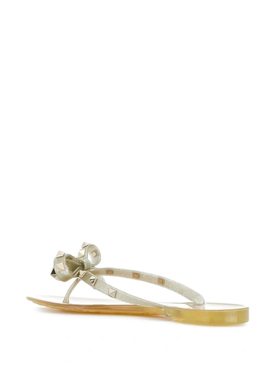 Shop Valentino Rockstud Thong In Gold
