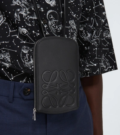 Shop Loewe Anagram Embossed Leather Pouch In Black