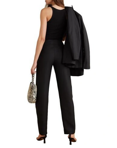 Shop Totême Pants In Black