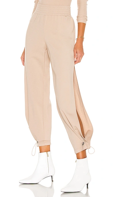 Shop Alice And Olivia Miami Side Slit Jogger In Nude