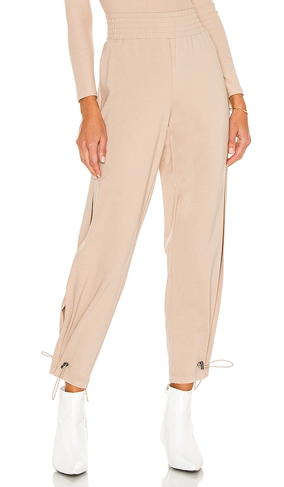 Shop Alice And Olivia Miami Side Slit Jogger In Nude