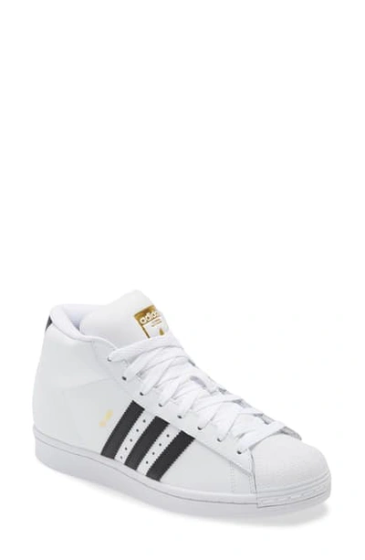 Shop Adidas Originals Pro Model J Mid Top Sneaker In White/ Black/ Gold Foil