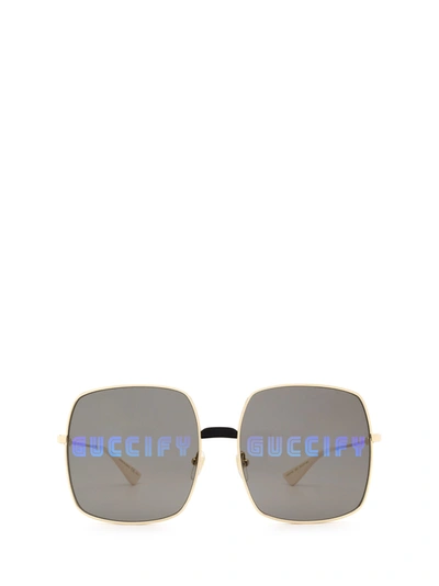 Shop Gucci Gg0414s Gold Sunglasses