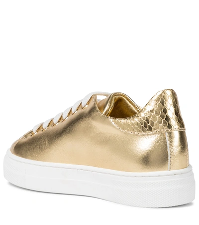 Shop Moschino Metallic Leather Sneakers In Gold
