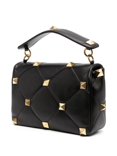 Shop Valentino Large Roman Stud Shoulder Bag In Black