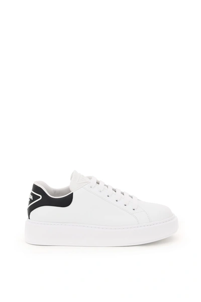 Shop Prada 045 Leather Sneakers In Bianco Nero (white)