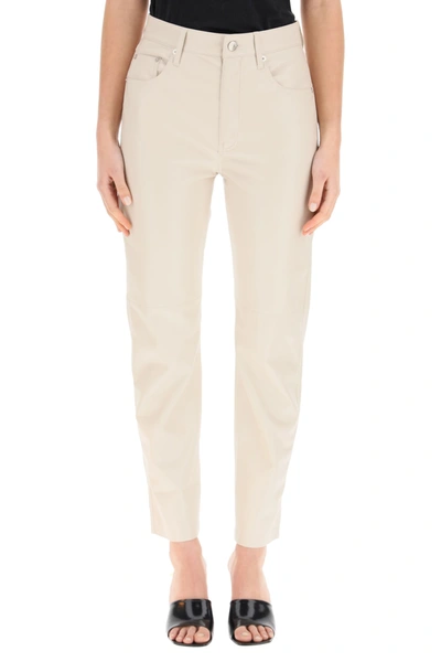 Shop Nanushka Vinni Faux Leather Trousers In Creme (beige)