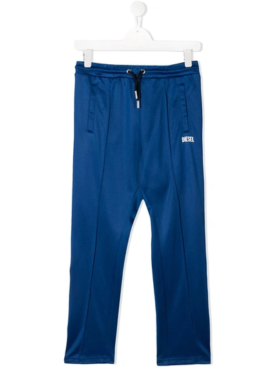 Shop Diesel Teen Pyegox Side Tape Track Pants In Blue