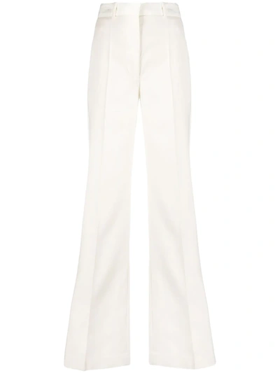 Shop Joseph Flared High-waist Trousers In White