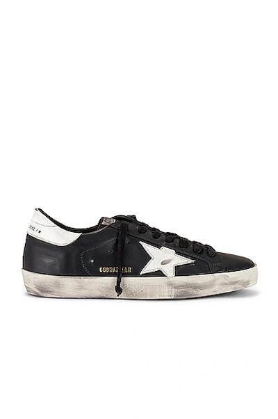 Golden Goose 'super-star' Black Low Top Sneakers With Logo Patch And Suede Details In Leather Man In Black & White