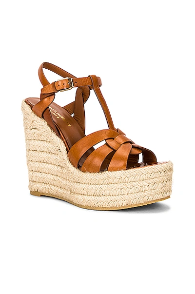 Shop Saint Laurent Tribute Espadrille Wedge Sandals In Ambre