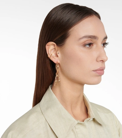 Shop Jacquemus Hoop Earrings In Raw Gold