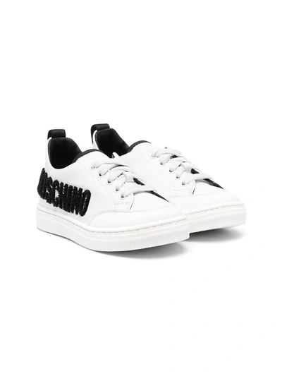 Shop Moschino Logo-embossed Leather Trainers In White