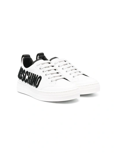 Shop Moschino Logo-embossed Leather Trainers In White