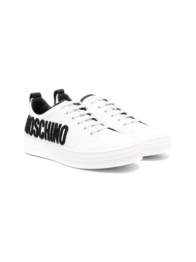 Shop Moschino Teen Logo-embossed Leather Trainers In White